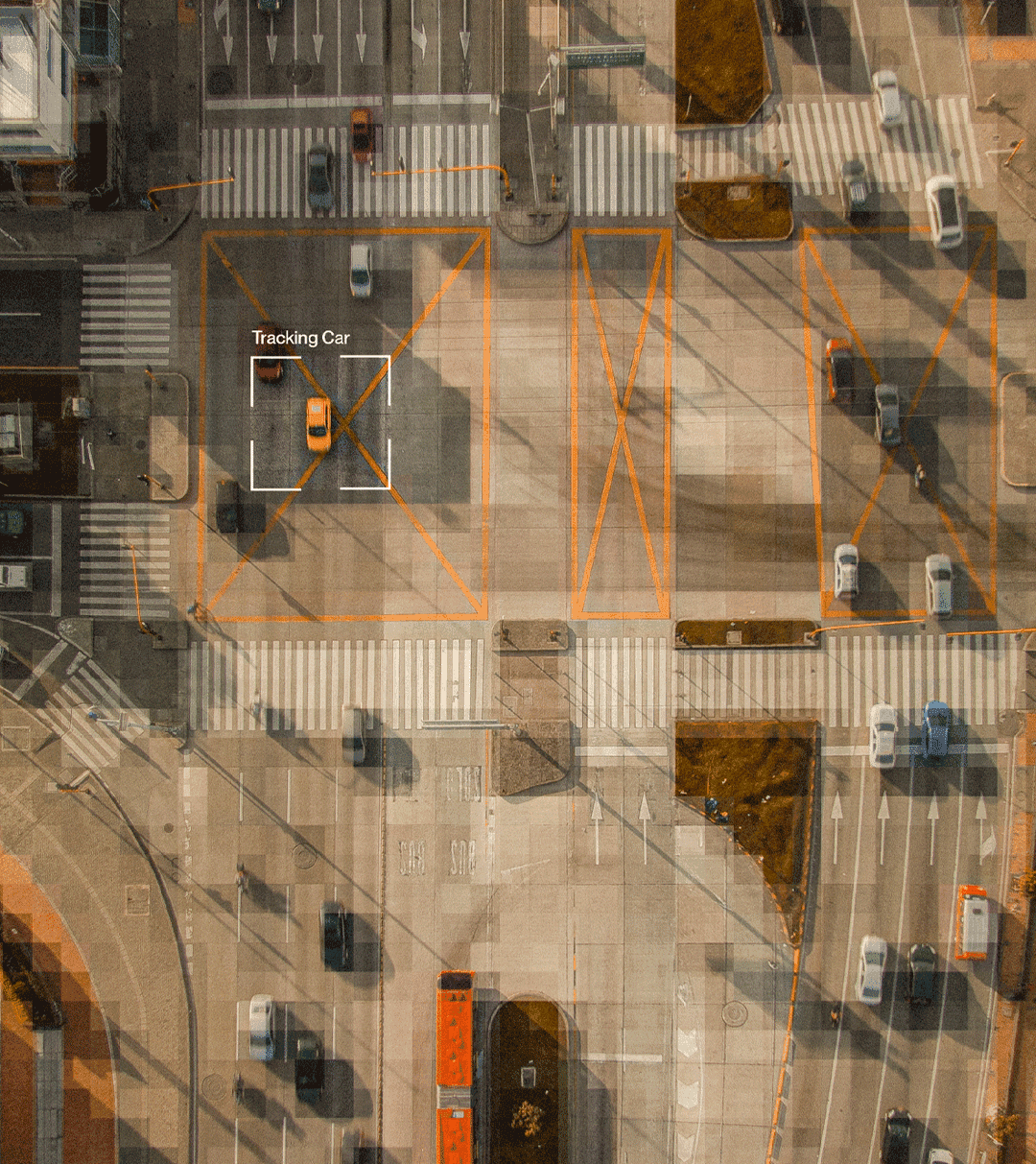 An overhead intersection with a tracking bracket around a car.